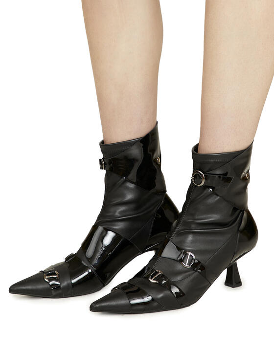 Belted black leather ankle boots